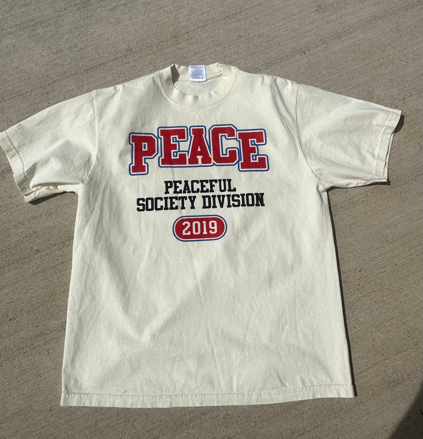Cream ‘Peaceful Division’ T Shirt